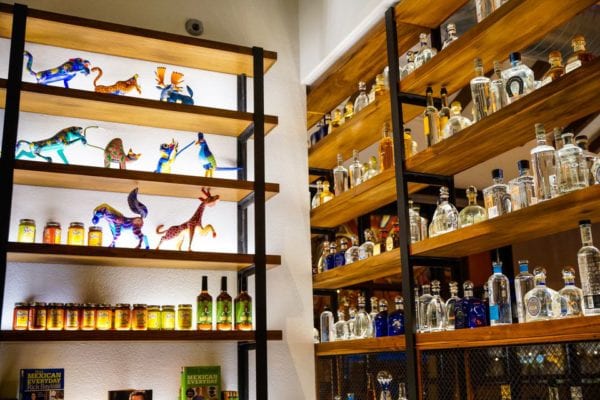 Frontera Cocina Review Tequila Shelves and Figurines