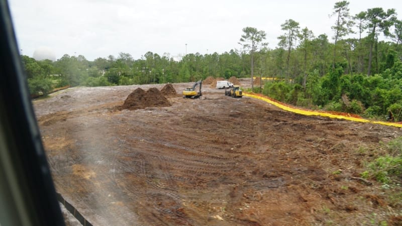Land Clearing for Epcot Hotel Support Area Started construction trucks