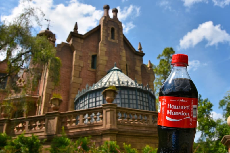 New Attraction-Based Coke Bottles Arrive in Disney Parks haunted mansion