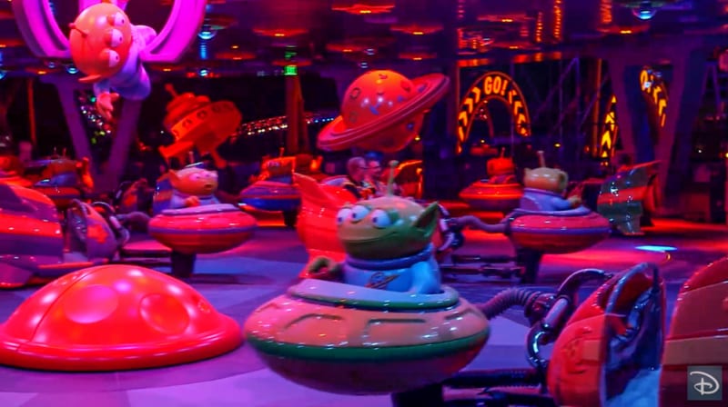 Nighttime Preview of Toy Story Land alien swirling saucers inside